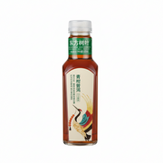 Bottle of Oriental Tree Leaves green tea on a white background